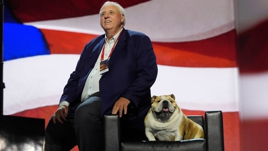 West Virginia Gov. Jim Justice checks out the stage with his dog, "Babydog," before the Republican National Convention. (AP File)