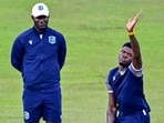 West Indies' Alzarri Joseph (R) and head coach Daren Sammy