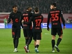 Barcelona's Brazilian forward #11 Raphinha (2L) celebrates with teammates Barcelona's Spanish forward #19 Lamine Yamal (L)