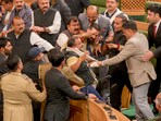 Ruckus in the Jammu and Kashmir Assembly after the speaker directed eviction of BJP members who had stormed the well during their protest over the special status resolution.