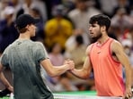 Spain's Carlos Alcaraz shakes hands with Italy's Jannik Sinner after winning their final match