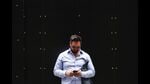 A man uses his phone as he stands on a footpath in central Sydney on November 7, 2024. Australia will move to pass new laws banning children under 16 from social media, Prime Minister Anthony Albanese said, vowing to crack down on tech giants failing to protect vulnerable users. (Photo by DAVID GRAY / AFP) (AFP)