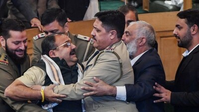 Srinagar, Nov 07 (ANI): Marshals remove BJP MLA after a brawl breaks out over a banner on the restoration of Article 370 displayed by Awami Ittehad Party (AIP) MLA and brother of Lok Sabha MP Engineer Rashid, Khurshid Ahmad Sheikh in the Jammu and Kashmir Legislative Assembly session, in Srinagar on Thursday. (ANI Photo) Srinagar, Nov 07 (ANI): Marshals remove BJP MLA after a brawl breaks out over a banner on the restoration of Article 370 displayed by Awami Ittehad Party (AIP) MLA and brother of Lok Sabha MP Engineer Rashid, Khurshid Ahmad Sheikh in the Jammu and Kashmir Legislative Assembly session, in Srinagar on Thursday. (ANI Photo)