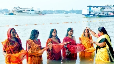 Vermilion being applied to a devotee on the banks of Ganga river during Chhath Puja festival, in Kolkata. Chhath Puja honors the Sun God and Chhathi Maiya. (ANI) Vermilion being applied to a devotee on the banks of Ganga river during Chhath Puja festival, in Kolkata. Chhath Puja honors the Sun God and Chhathi Maiya. (ANI)