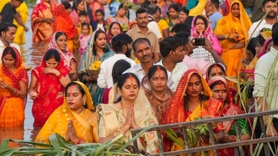 Devotees worship the setting sun during Chhath Puja, at Laxman Mela Ground on the banks of the River Gomti in Lucknow. (PTI) Devotees worship the setting sun during Chhath Puja, at Laxman Mela Ground on the banks of the River Gomti in Lucknow. (PTI)