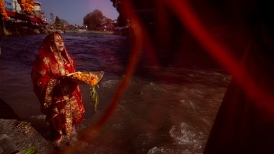 A Nepalese woman offers prayers to the setting sun on the bank of Bagmati River. (AP) A Nepalese woman offers prayers to the setting sun on the bank of Bagmati River. (AP)
