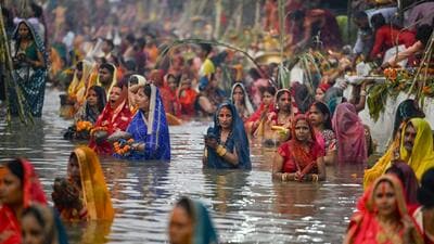 Devotees perform Chhath Puja inside a temporary pond at ITO Ghat in New Delhi on Thursday. (RAJ K RAJ /HT PHOTO) Devotees perform Chhath Puja inside a temporary pond at ITO Ghat in New Delhi on Thursday. (RAJ K RAJ /HT PHOTO)