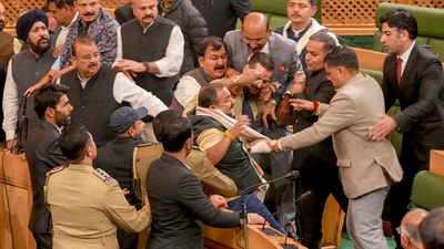 Ruckus in the Jammu and Kashmir Assembly after the speaker directed eviction of BJP members who had stormed the well during their protest over the special status resolution. (PTI) Ruckus in the Jammu and Kashmir Assembly after the speaker directed eviction of BJP members who had stormed the well during their protest over the special status resolution. (PTI)