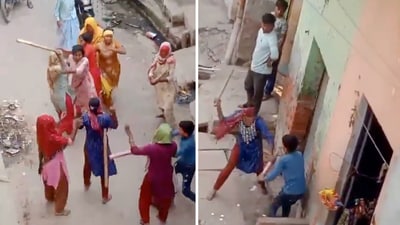 The video opens to chaos on a Baghpat street as women run around thrashing each other with sticks. (X/@anwar0262) The video opens to chaos on a Baghpat street as women run around thrashing each other with sticks. (X/@anwar0262)
