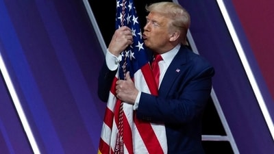 Donald Trump kissed and hugged the American flag ahead of his speech. (X/@tvnecro) Donald Trump kissed and hugged the American flag ahead of his speech. (X/@tvnecro)