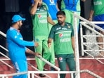 Pakistan's captain Babar Azam, right, shakes hands with Indian captain Rohit Sharma after the Asia Cup match Pakistan's captain Babar Azam, right, shakes hands with Indian captain Rohit Sharma after the Asia Cup match