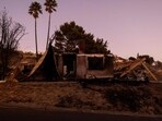 Remains of a house destroyed by the Mountain Fire, fueled by strong Santa Ana winds, are seen in Camarillo, California, on November 7, 2024.