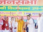 Uttar Pradesh chief minister Yogi Adityanath holds a mace during a public meeting for the Kundarki Assembly Constituency by-election, in Moradabad on Friday. (Yogi Adityanath-X/ANI Photo) Uttar Pradesh chief minister Yogi Adityanath holds a mace during a public meeting for the Kundarki Assembly Constituency by-election, in Moradabad on Friday. (Yogi Adityanath-X/ANI Photo)