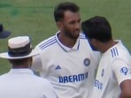 India A players have a discussion with the umpire.
