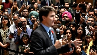 Attendees use their phones to record Canadian Prime Minister Justin Trudeau as he delivers remarks at the Diwali and Bandi Chhor Divas on the Hill celebration in Ottawa, Ontario, ob Monday, (AP) Attendees use their phones to record Canadian Prime Minister Justin Trudeau as he delivers remarks at the Diwali and Bandi Chhor Divas on the Hill celebration in Ottawa, Ontario, ob Monday, (AP)
