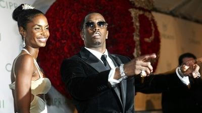 Sean "P. Diddy" Combs directs photographers as they sing "Happy Birthday," to him as his date Kim Porter, left, listens, after Combs arrived for his 35th birthday celebration at Cipriani on Wall Street in New York, Nov. 4, 2004. (AP) Sean "P. Diddy" Combs directs photographers as they sing "Happy Birthday," to him as his date Kim Porter, left, listens, after Combs arrived for his 35th birthday celebration at Cipriani on Wall Street in New York, Nov. 4, 2004. (AP)