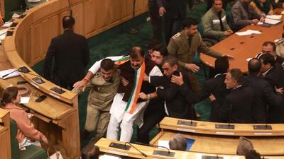 Marshals removing BJP legislators from the House after ruckus during the assembly session in Srinagar. (Waseem Andrabi/HT) Marshals removing BJP legislators from the House after ruckus during the assembly session in Srinagar. (Waseem Andrabi/HT)