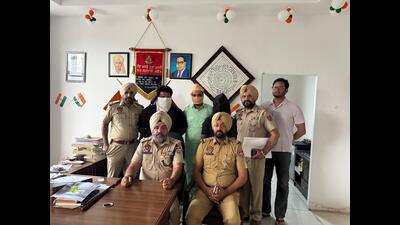 Mohali police with the arrested accused on Friday. (HT Photo)