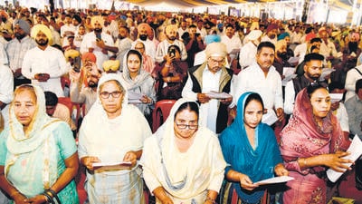 Newly elected sarpanches taking oath of office at Dhanasu village in Ludhiana on Friday. (HT photo)