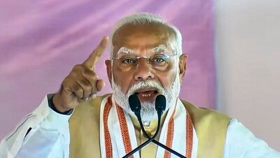 Prime Minister Narendra Modi addresses a public meeting ahead of the Maharashtra Assembly elections in Dhule district of Maharashtra on Friday. (PTI) (PTI) Prime Minister Narendra Modi addresses a public meeting ahead of the Maharashtra Assembly elections in Dhule district of Maharashtra on Friday. (PTI) (PTI)