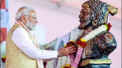 Prime Minister Narendra Modi pays tribute to Chhatrapati Shivaji Maharaj during a public meeting for the Maharashtra Assembly elections, in Nashik on Friday. (ANI) Prime Minister Narendra Modi pays tribute to Chhatrapati Shivaji Maharaj during a public meeting for the Maharashtra Assembly elections, in Nashik on Friday. (ANI)