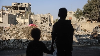 TOPSHOT - Children sit on a couch amid the destruction following an Israeli strike in the Nuseirat refugee camp in the central Gaza Strip on November 7, 2024, amid the ongoing war between Israel and Palestinian Hamas militants. (Photo by Eyad BABA / AFP) (AFP) TOPSHOT - Children sit on a couch amid the destruction following an Israeli strike in the Nuseirat refugee camp in the central Gaza Strip on November 7, 2024, amid the ongoing war between Israel and Palestinian Hamas militants. (Photo by Eyad BABA / AFP) (AFP)