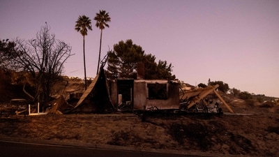 Remains of a house destroyed by the Mountain Fire, fueled by strong Santa Ana winds, are seen in Camarillo, California, on November 7, 2024. (AFP)