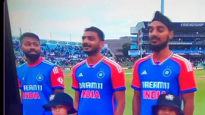 Hardik Pandya looks at his teammates as the national anthem resumes after a technical glitch (X) Hardik Pandya looks at his teammates as the national anthem resumes after a technical glitch (X)