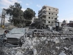 Resident check the site of an Israeli airstrike in Tyre, southern Lebanon, Saturday, Nov. 9, 2024. Resident check the site of an Israeli airstrike in Tyre, southern Lebanon, Saturday, Nov. 9, 2024.