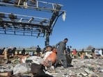 A man carries passengers' belongings from the blast site after an explosion at a railway station in Quetta, in Pakistan's Balochistan province on November 9, 2024. A man carries passengers' belongings from the blast site after an explosion at a railway station in Quetta, in Pakistan's Balochistan province on November 9, 2024.