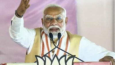 **EDS: SCREENSHOT VIA NARENDRA MODI YOUTUBE** Dhule: Prime Minister Narendra Modi addresses a public meeting ahead of the Maharashtra Assembly elections, in Dhule district of Maharashtra, Friday, Nov. 8, 2024. (PTI Photo)(PTI11_08_2024_000099A) (PTI) **EDS: SCREENSHOT VIA NARENDRA MODI YOUTUBE** Dhule: Prime Minister Narendra Modi addresses a public meeting ahead of the Maharashtra Assembly elections, in Dhule district of Maharashtra, Friday, Nov. 8, 2024. (PTI Photo)(PTI11_08_2024_000099A) (PTI)