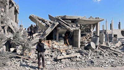 People sift through the rubble of a building destroyed during Israeli Bombardment, in Beit Lahia in the northern Gaza Strip on November 5, 2024, amid the ongoing war between Israel and the Palestinian militant group Hamas. (Photo by AFP) (AFP) People sift through the rubble of a building destroyed during Israeli Bombardment, in Beit Lahia in the northern Gaza Strip on November 5, 2024, amid the ongoing war between Israel and the Palestinian militant group Hamas. (Photo by AFP) (AFP)