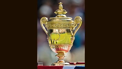 Today it seems absurd that pineapples were once prized fruits, but look closely and the legacy endures: an intricate, tiny replica of a pineapple still sits atop the Wimbledon men’s singles trophy. (Getty Images) Today it seems absurd that pineapples were once prized fruits, but look closely and the legacy endures: an intricate, tiny replica of a pineapple still sits atop the Wimbledon men’s singles trophy. (Getty Images)