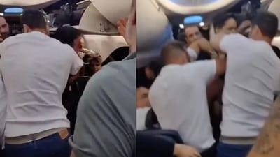 A Copa Airlines passenger attempted to open the emergency door mid-flight, but fellow passengers restrained him. (X/@NelsonCarlosd15) A Copa Airlines passenger attempted to open the emergency door mid-flight, but fellow passengers restrained him. (X/@NelsonCarlosd15)