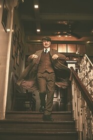 Anupam Kher embodies vintage sophistication in this striking monochrome ensemble by Don & Julio. The well-fitted three-piece suit, paired with a beige-brown checked overcoat, a tie, and a flat cap effortlessly blends refinement with old-world charm (Photo: Priyankk Nandwana) Anupam Kher embodies vintage sophistication in this striking monochrome ensemble by Don & Julio. The well-fitted three-piece suit, paired with a beige-brown checked overcoat, a tie, and a flat cap effortlessly blends refinement with old-world charm (Photo: Priyankk Nandwana)