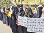 Women and girls holding placards stage a peaceful protest over the hijab ban imposed in the few colleges in Karnataka