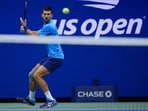 Novak Djokovic, of Serbia, returns a shot. Novak Djokovic, of Serbia, returns a shot.