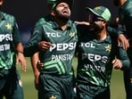 Pakistan's Babar Azam and Kamran Ghulam celebrate in Perth during the third ODI. Pakistan's Babar Azam and Kamran Ghulam celebrate in Perth during the third ODI.