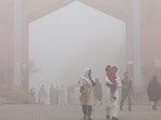 Visitors walk out from the Bhumi Fort amid heavy smoggy conditions in Multan on November 9, 2024. Visitors walk out from the Bhumi Fort amid heavy smoggy conditions in Multan on November 9, 2024.
