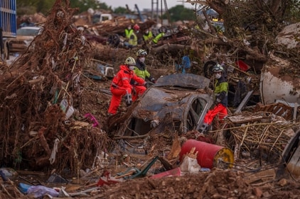 Emergency services remove cars in an area affected by floods in Catarroja, Spain. (AP) Emergency services remove cars in an area affected by floods in Catarroja, Spain. (AP)