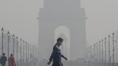 A morning walker wears a face mask at Kartavya Path as air quality continues to remain poor in New Delhi. (PTI Photo) A morning walker wears a face mask at Kartavya Path as air quality continues to remain poor in New Delhi. (PTI Photo)