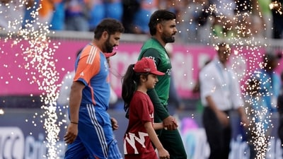 Pakistan star batter Babar Azam, right, and India's captain Rohit Sharma. (PTI) Pakistan star batter Babar Azam, right, and India's captain Rohit Sharma. (PTI)
