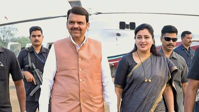 Maharashtra deputy chief minister Devendra Fadnavis with BJP leader Navneet Rana during an election rally ahead. (PTI file photo)