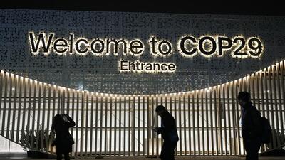 People walk outside the venue for the COP29 UN Climate Summit, Monday, Nov. 11, 2024, in Baku, Azerbaijan. (AP) People walk outside the venue for the COP29 UN Climate Summit, Monday, Nov. 11, 2024, in Baku, Azerbaijan. (AP)