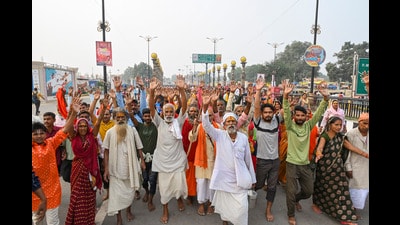 Saints and devotees perform 'Panch Kosi Parikrama', at the Naya Ghat of Ayodhya, Monday. (PTI)