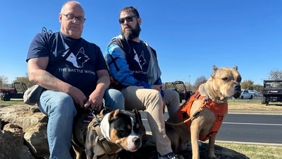 Retired Army First Sgt. Timothy Siebenmorgen, left, and retired Marine Corps Cpl. Mark Atkinson sit with their service dogs, Rosie and Lexi. (AP Photo/Nick Ingram) Retired Army First Sgt. Timothy Siebenmorgen, left, and retired Marine Corps Cpl. Mark Atkinson sit with their service dogs, Rosie and Lexi. (AP Photo/Nick Ingram)