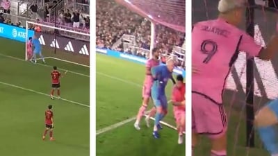 Lionel Messi clashes with Brad Guzan.