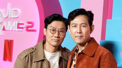 Squid Game director Hwang Dong-Hyuk admitted to losing several teeth from the stress of making the sequel. (@netflixqueue/X)