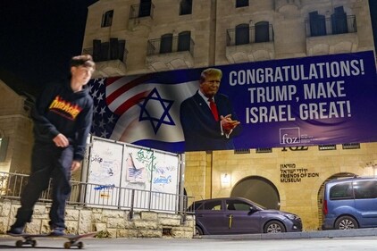 A youth skateboards under a banner congratulating US President-elect Donald Trump on winning the US presidential election in Jerusalem on November 7, 2024. (File image) (AFP)