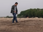 Dr Jaafar al Jotheri holds satellite images and explores the site of the Battle of al-Qadisiyah, which was fought in Mesopotamia - present-day Iraq - in the 630s AD between Arab Muslims and the army of the Sassanid Persian dynasty during a period of Muslim expansion.